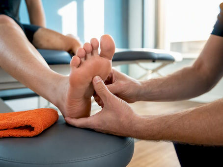 Clinician assessing painful forefoot for sesamoiditis