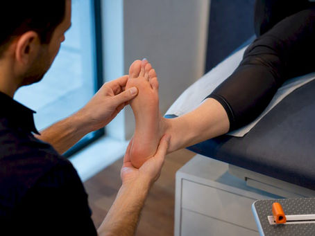 Clinician conducting an orthotic foot assessment