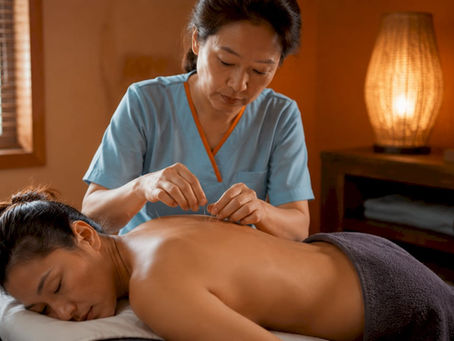Acupuncturist treating woman’s neck pain