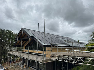 New build house under construction with roofing and solar panels fitted