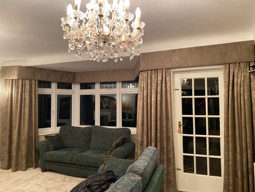 luxurious suede effect curtains in sable covering bay window and front door
