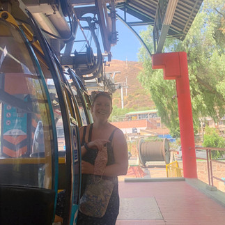 Becca climbing in the Teleferico up to Monumento Cristo de la Concordia