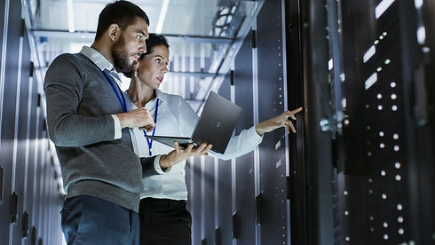Male IT Specialist Holds Laptop and Disc