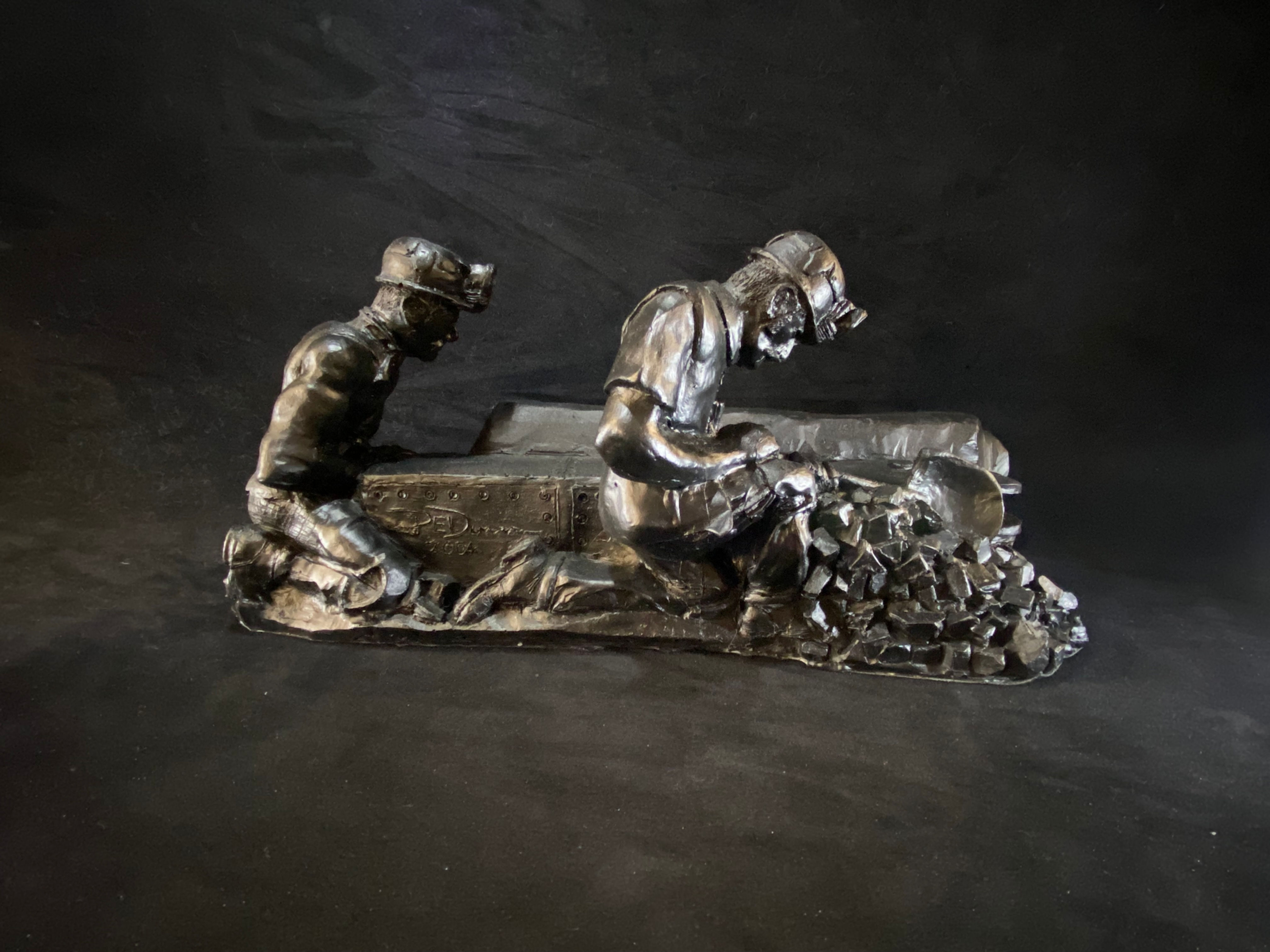 Coal cutter miner figurine handcrafted British mining memorabilia collectible statue