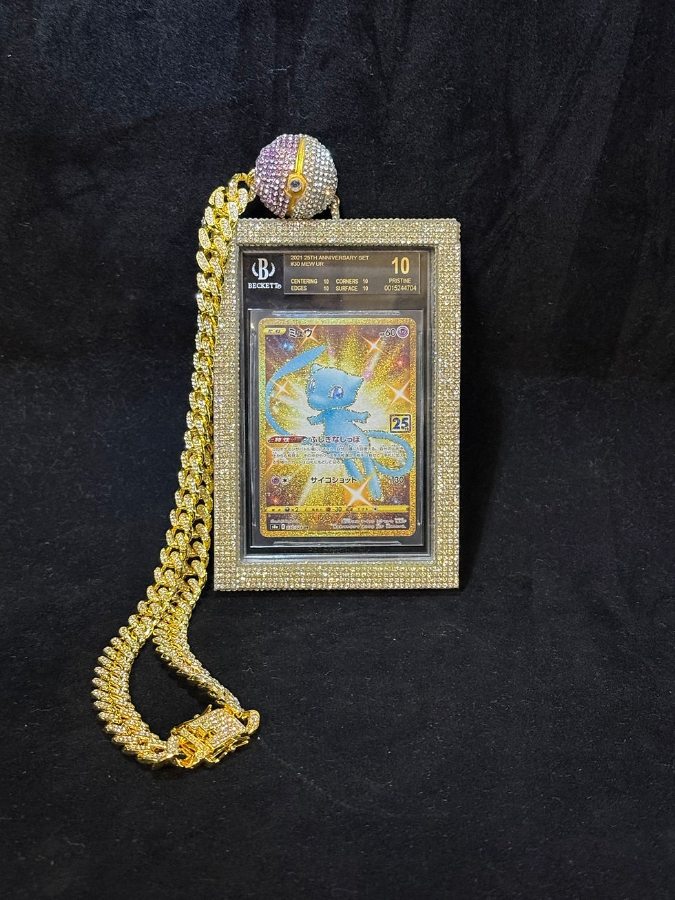 Thumbnail: Close-up of Pokémon Illustrator replica pendant in Beckett slab with iced-out chain