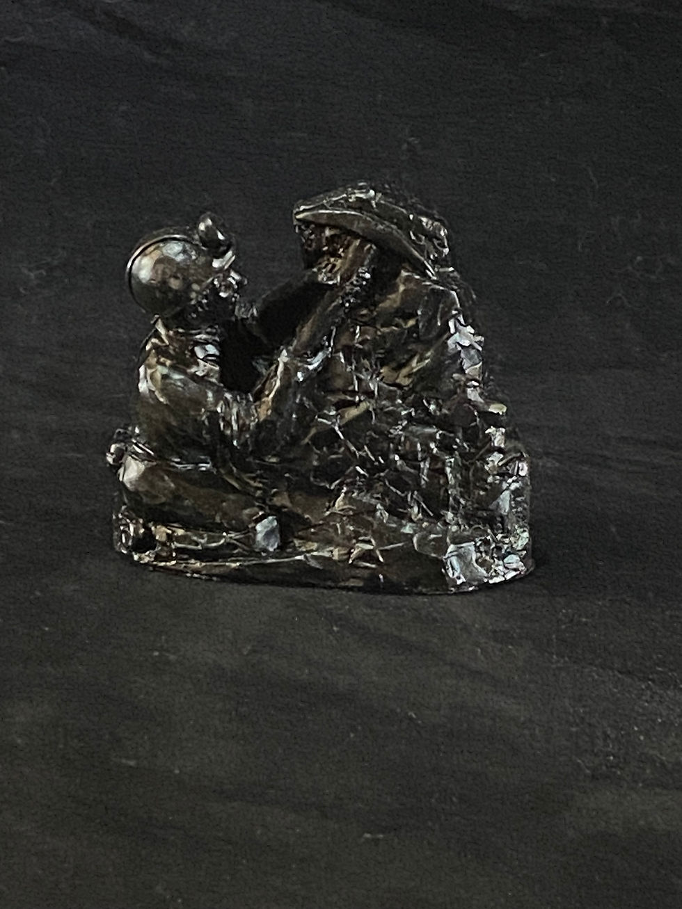 Thumbnail: mining figurine