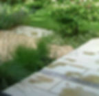 Pebble strip detail within paving
