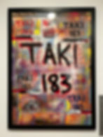 Mapa del metro de Nueva York cubierto de graffiti con texto "TAKI 183" en letras negras y rojas. Fondo colorido y vibrante. Muestra arte urbano.