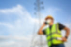 Premium Photo _ Asian male electrical engineer standing holding a blueprint at the working