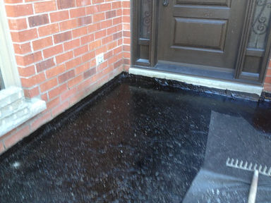 Front step and entry base preparation with surface coating and drainage detail by Horvath Landscapes