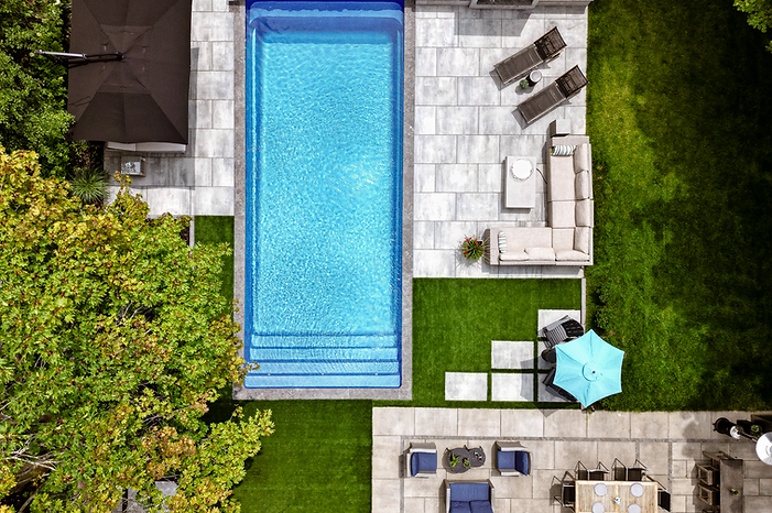 Blackforest backyard design with pool, artificial turf, patio, hot tub, and stone steps