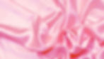 Pink satin in the background.