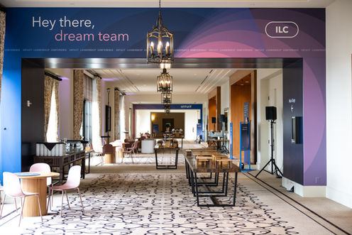 Intuit Leadership Conference entrance graphic reading "Hey there, dream team"