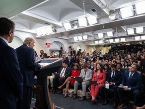 President Donald Trump speaks from the podium in the James S. Brady Press Briefing Room as reporters and television cameras face him