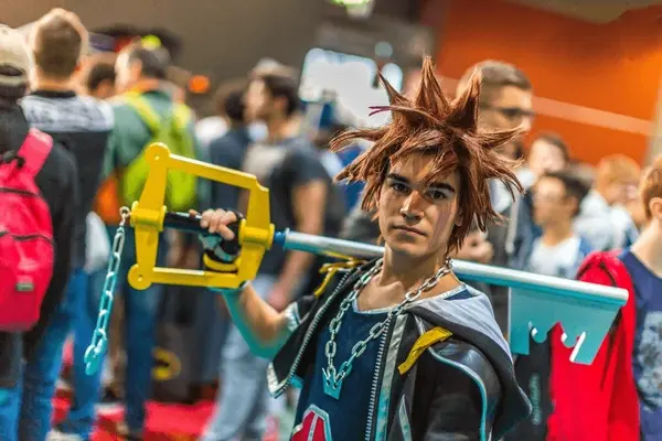 Photo: Cosplayer with prop at convention (royalty-free stock)