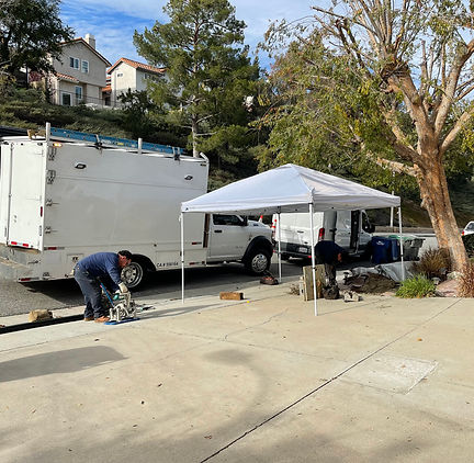 Tenchless sewer pipe bursting equipment in use