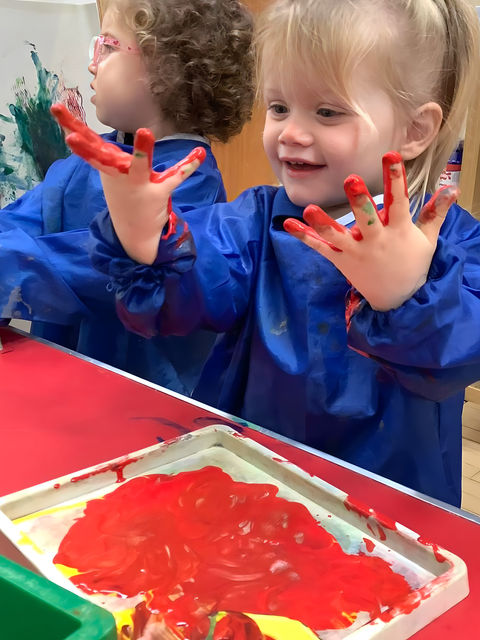 Toddler playing with paint