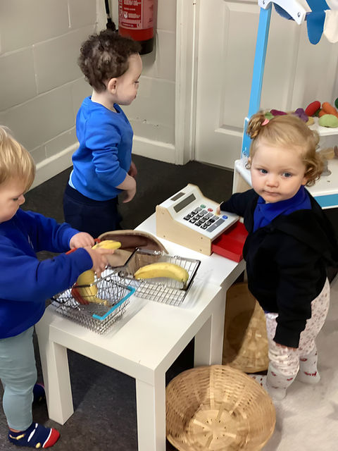 Young nursery toddlers playing make believe