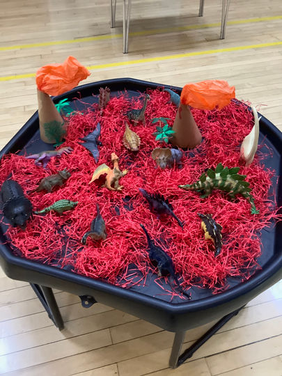 Dinosaur tuff tray play at Nursery