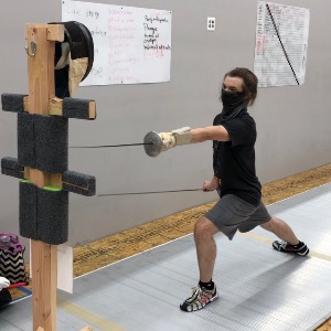 CEFC Fencer training on a target during the COVID-19 Pandemic