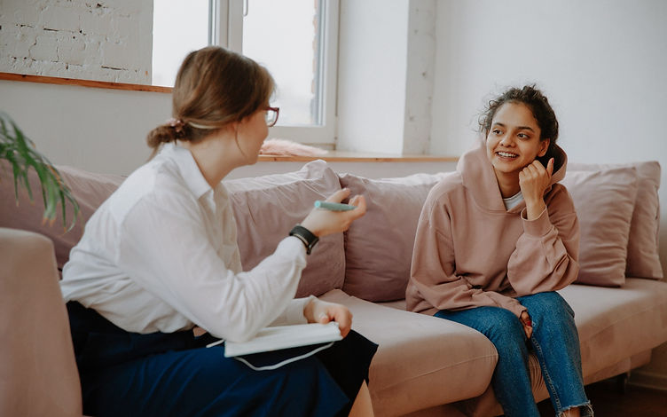 Two young women chatting.