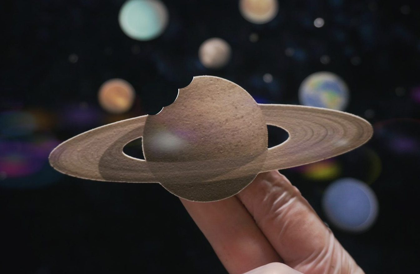 Edible planet decorations for a space themed cake