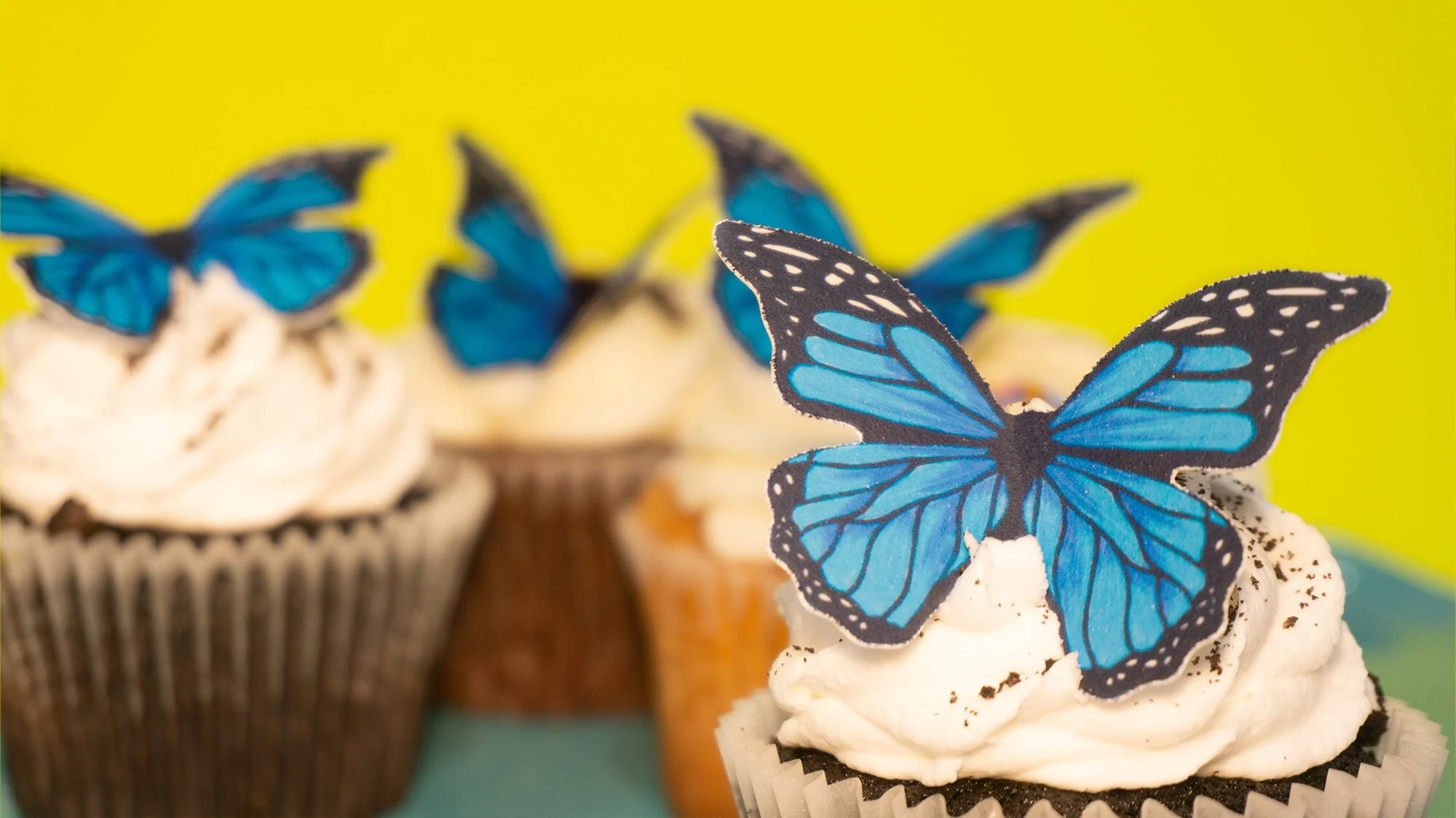 Blue monarch edible butterfly decorations for a wedding cake