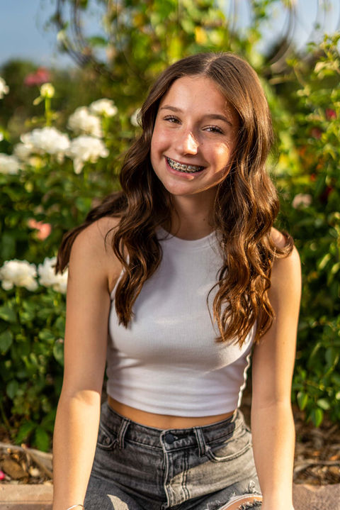 Smiling young woman with braces, LW Productions