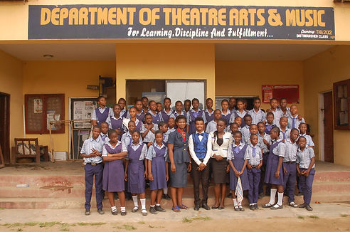 a picture of the actors and teachers on a stage after a performance