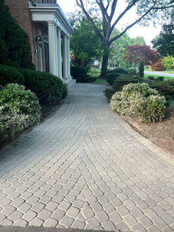 Interlock walkway after polymeric sanding in Oakville Ontario with joints refilled stabilized and clean defined paver pattern