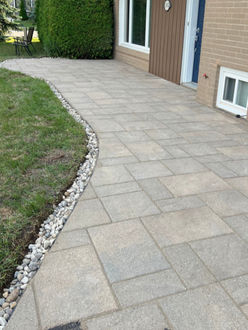 Interlock patio after extension and installation with new stone border in Oakville Ontario