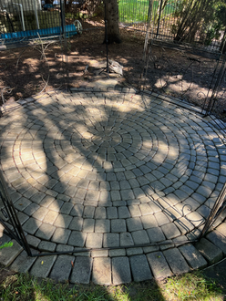 Backyard circle interlock patio before pressure washing sanding sealing in Oakville