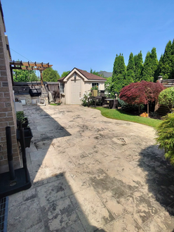 Interlock driveway before pressure washing in Oakville Ontario showing surface staining dirt buildup and discoloured pavers prior to cleaning