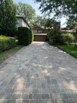 Cobble interlock driveway after pressure washing sanding and sealing with restored colour and stabilized joints Ancaster