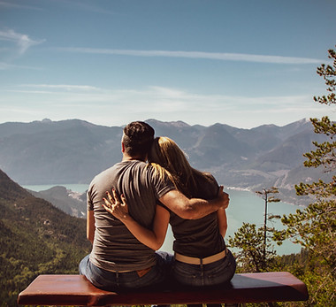 "A therapist facilitating a couples therapy session, where two partners are actively engaging in conversation, showcasing a supportive environment for improving communication and resolving relationship issues."