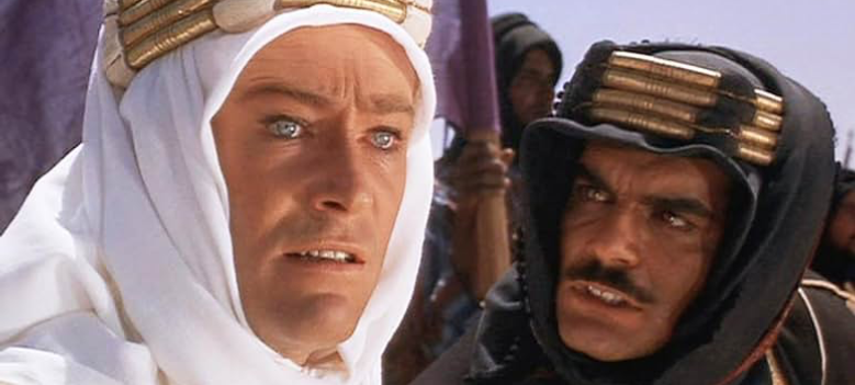 Sherif Ali (Omar Sharif) looks up to T. E. Lawrence (Peter O’Toole), whose charisma and leadership are key to winning the war against the Turks. Image courtesy of IMDb.com.