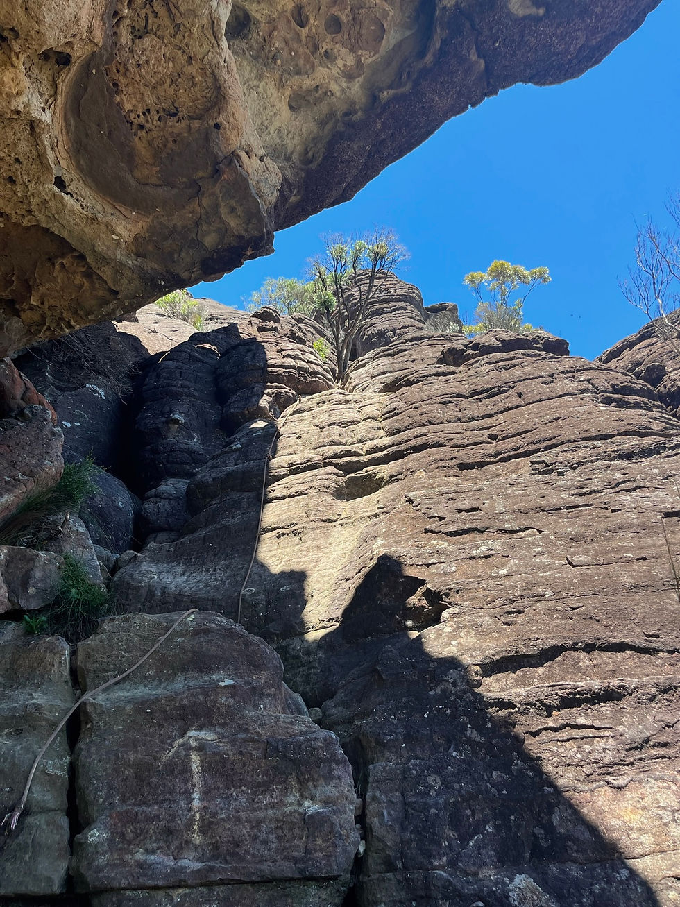 A rope and an arrow on rocks