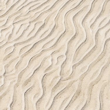 Wellenformen im Sand. Hintergrundbild Systemische Therapie.