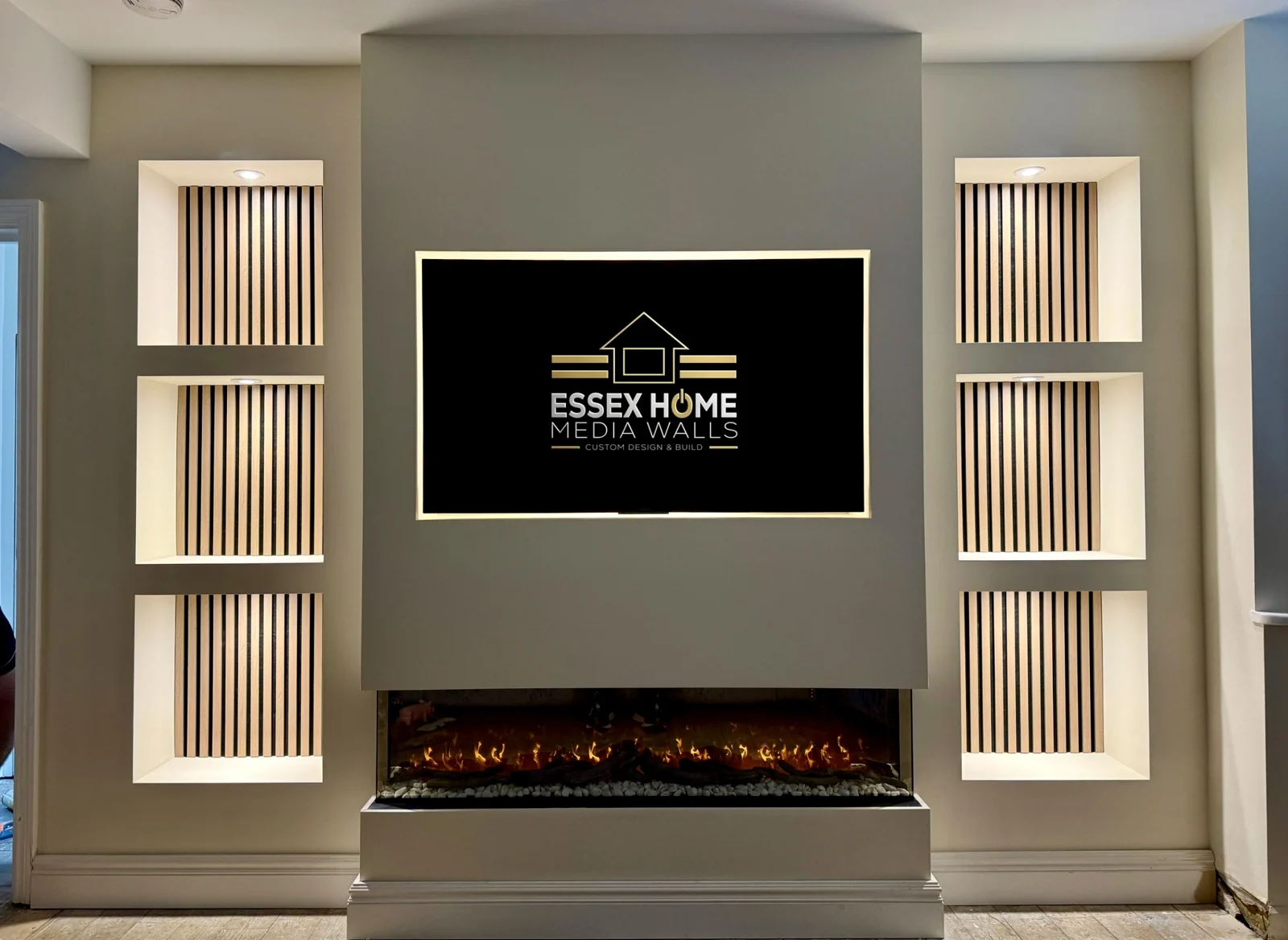 TV wall with tall timber-effect slatted niches and an electric fire