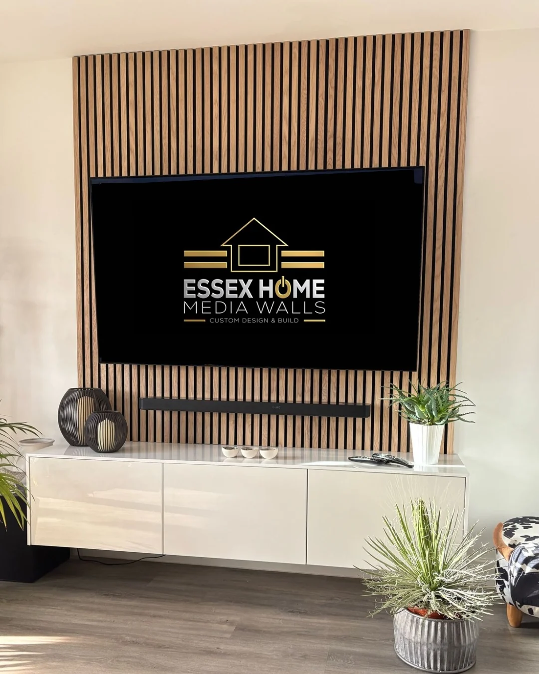 TV feature wall with timber slats and a floating storage console
