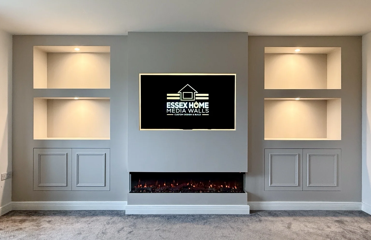 Grey media wall with shaker-style cupboards, open niches and an electric fire