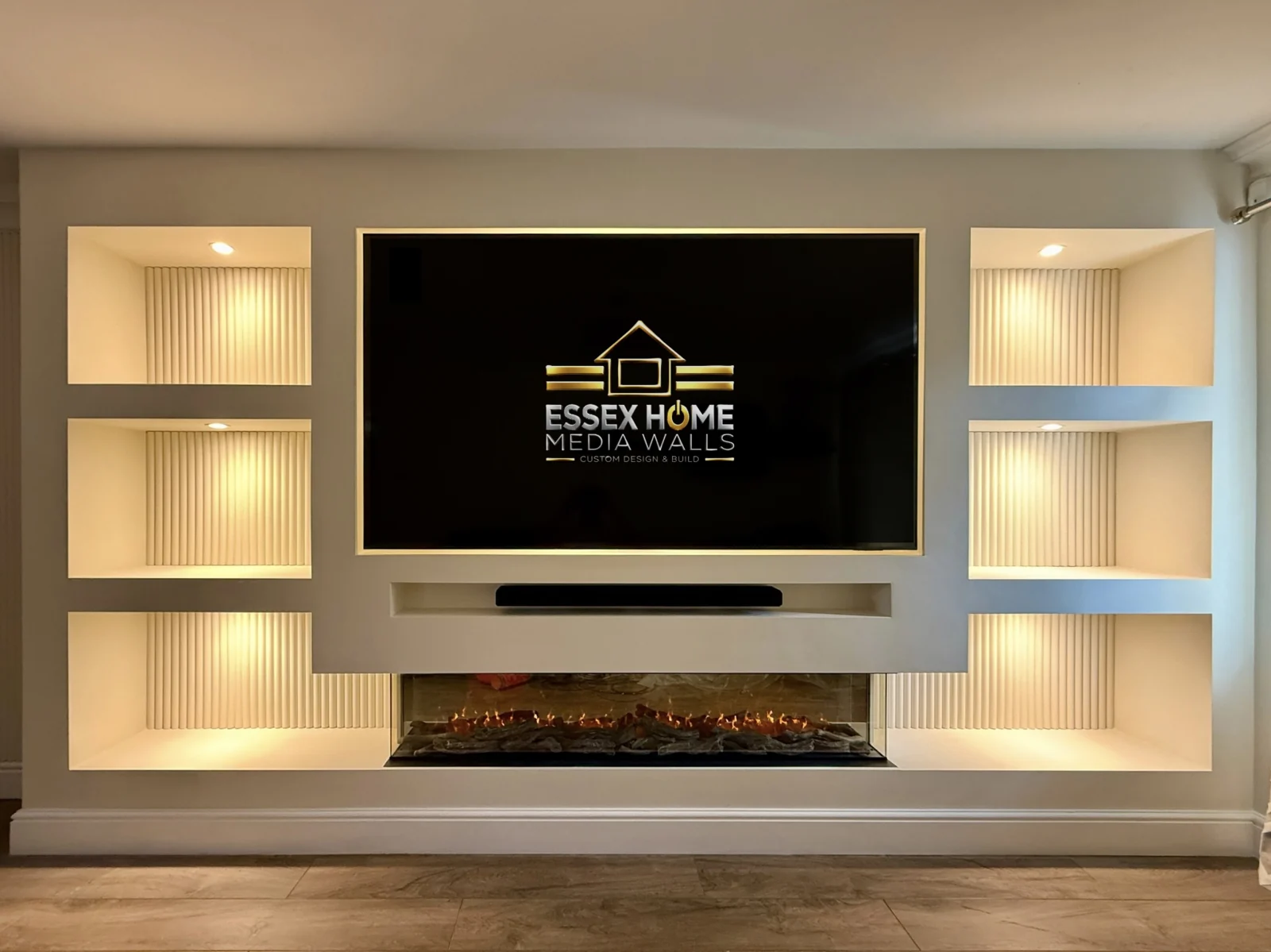White media wall with six warm-lit ribbed display niches