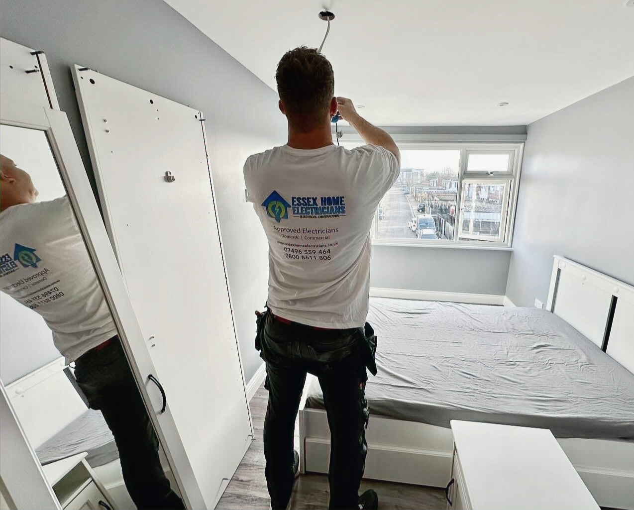 Essex Home Electricians team installing lighting in a home