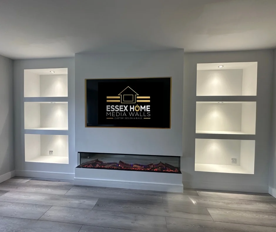 Pale media wall with open lit niches and an electric fire