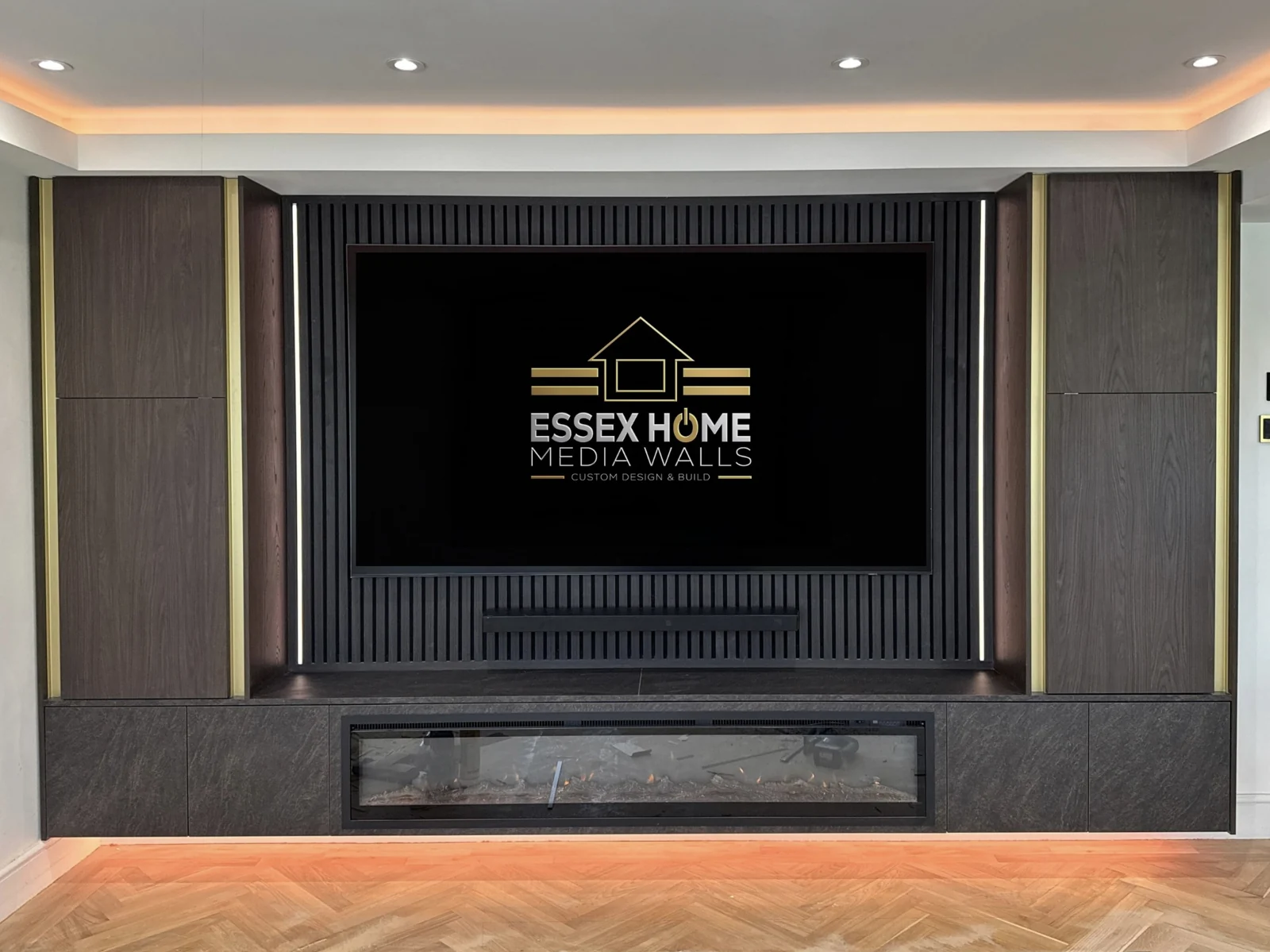 Dark media wall with tall cupboards, vertical panelling and warm accent lighting