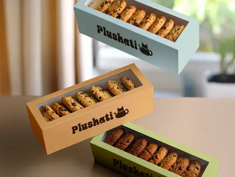 Cookie packaging boxes design. Cozy cat cafe branding, cute pet restaurant brand identity, fun animal brand design, hand-drawn cat feline and home illustrations and icons, adorable cat teapot logo design, playful logotype, orange blue green brown color palette. Visual identity design, brand guidelines, digital branding, fun brand design, bright bold branding, creative instagram page branding. Warm / Playful / Inviting / Charming / Caring / Fun / Feline / Cozy. Brand strategy, logo suite, brand graphics, brand identity, loyalty card, menu, posters stickers.

Brand Designer, Logo Designer, Graphic Designer, Packaging Designer, Branding Services, Packaging Design, Product Design, Graphic Design, Visual Identity. Branding Agency, Branding Studio, Graphic Design Studio, Freelance Designer, Small Business Branding, Female branding, Lexielogo, Logomark.