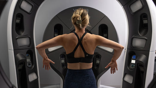 Woman in Wb360 3D skin scan machine