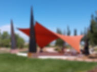 Installed shade sail canopy over an outdoor patio, manufactured by Wholesale Shade