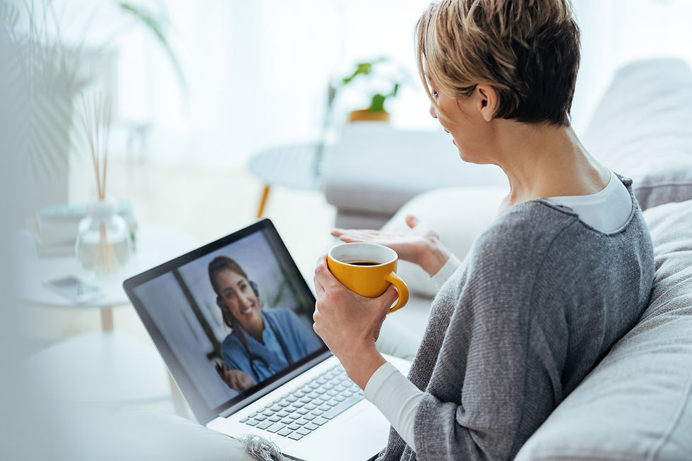 woman-using-laptop-having-video-call-with-her-doctor-while-sitting-home.jpg