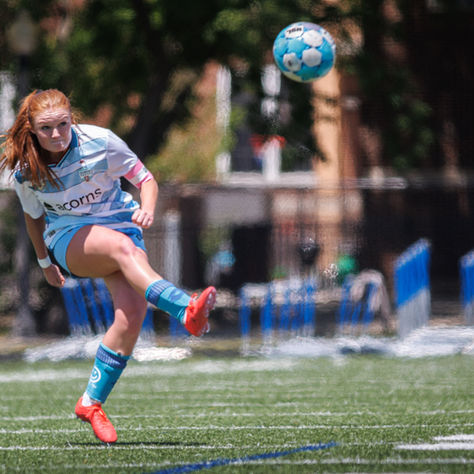 Kily Egan kicking the soccer ball